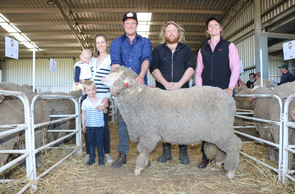 Mianelup stud's Marthe Du Plessis d'Argentre (left), with Celeste, Joe and Elliot Richardson, Gnowangerup, handling the $2200 Poll Merino sold in lot two with buyer Lachlan Lewis, Pallinup stud, Gnowangerup and Elders trainee Clare Grainger.