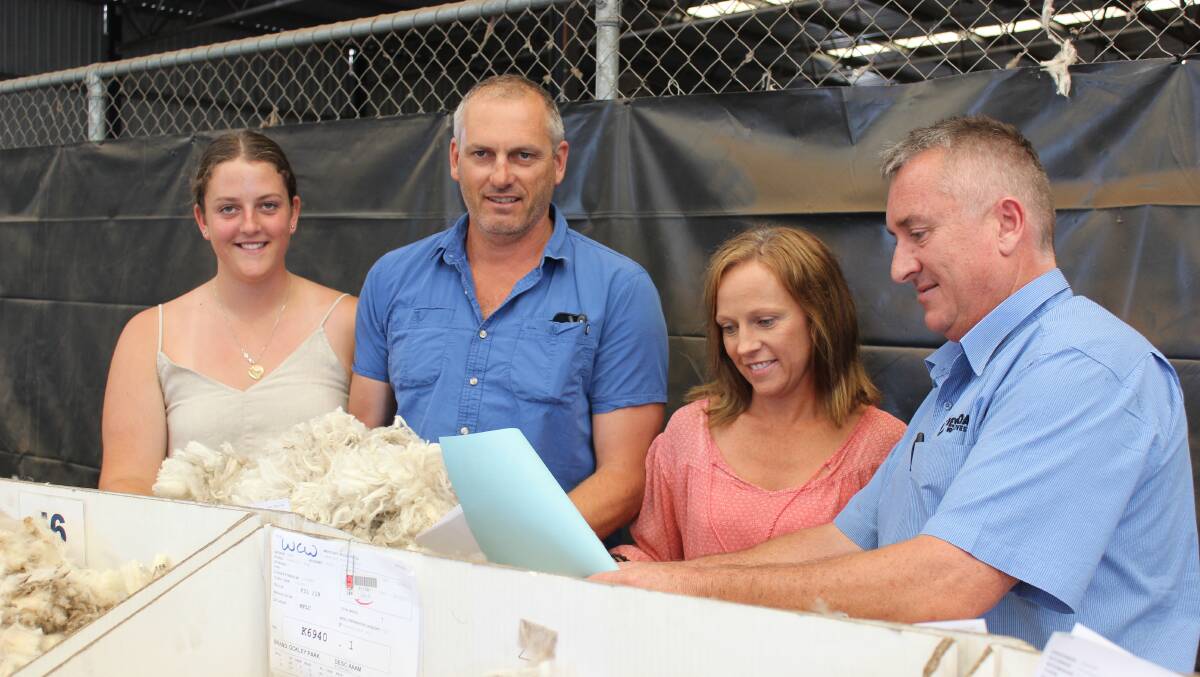 Zoe, Dave and Katherine Vandenberghe, Scaddan, inspecting their wool samples on the Westcoast Wool & Livestock show floor in January with auctioneer and broker Danny Ryan. Enthused by the future of wool after attending an Australian Wool Innovation industry consultative committee meeting in Sydney the day before, Mr Vandenberghe set himself a target of producing 300 bales of wool in 2019.