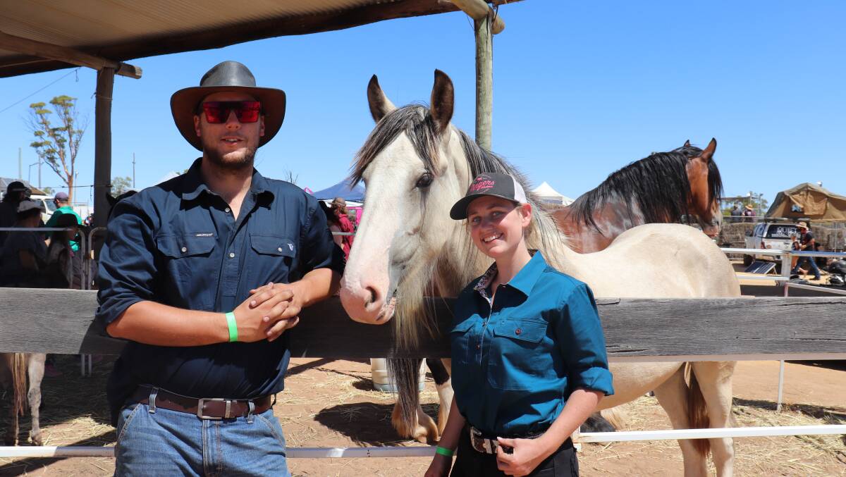 Josh Phillips (left), Mundaring, was admiring the horses with Brittany Mayberry, Forrestdale.