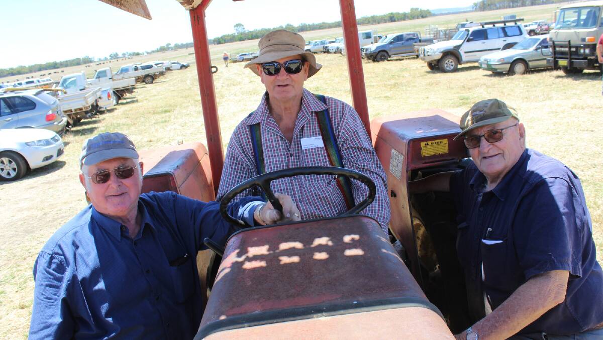 Tractor connoisseurs Norm Barrett (left), Ken Wait, Napier and Les Woods, Esperance, had a look over the array of tractors at the Woodward clearing sale.
