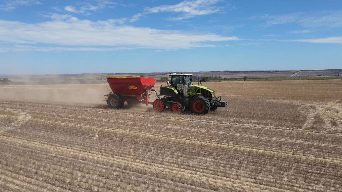 The CLAAS 960 Axion Terra Trac pulling the spreader on Amery Drage's farm at Northampton.