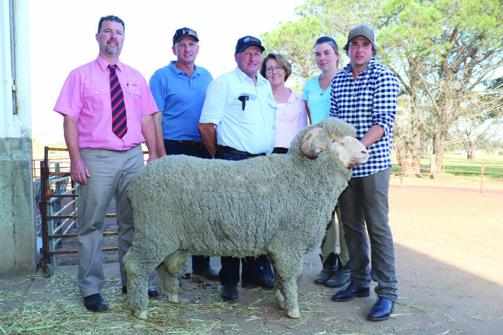 The $7600 second top price ram at the Woodyarrup on-property ram sale was bought by the Arra-dale stud, Perenjori. With the ram were Elders auctioneer Nathan King (left), Ashley Sutherland, Arra-dale, Woodyarrup stud co-principal Craig Dewar, Sandra Gianoli, Woodyarrup, Woodyarrup stud groom Tara Wright and Woodyarrup stud co-principal Lachlan Dewar.