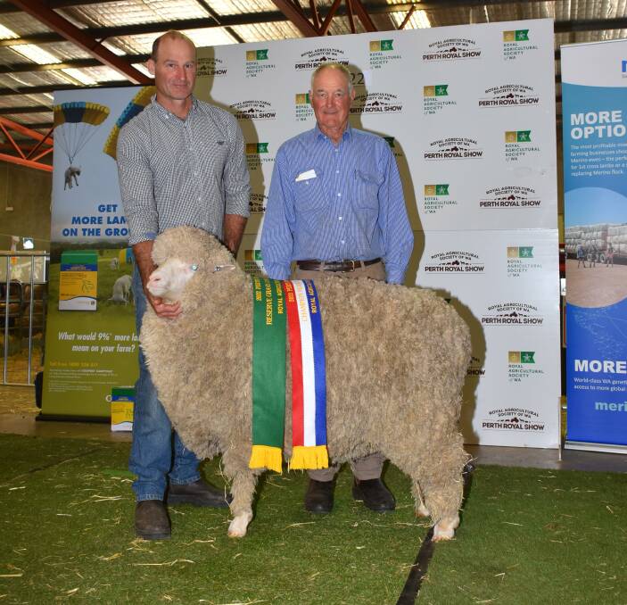 Dongiemon stud principals Andrew (left) and Stuart Rintoul, Williams, with their reserve grand champion August shorn and champion strong wool Merino ewe.