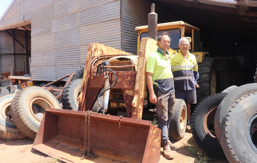 Carnamah big tractor project committee chairman Brendon Haeusler (left) and his father Trevor with the 1970s Chamberlain C670 tractor with front-end loader bucket and three-point linkage that is first prize in a Vintage Tractor & Machinery Association of WA (Tracmach WA) raffle to raise funds for the big tractor tourist attraction project. Trevor Haeusler got the seized engine of a 1936 Case L Model tractor running which is a ticket holders choice option for second prize in the raffle.