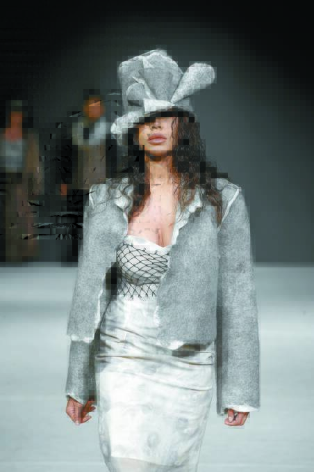 An alpaca jacket and hat being modelled at Vancouver Fashion Week.