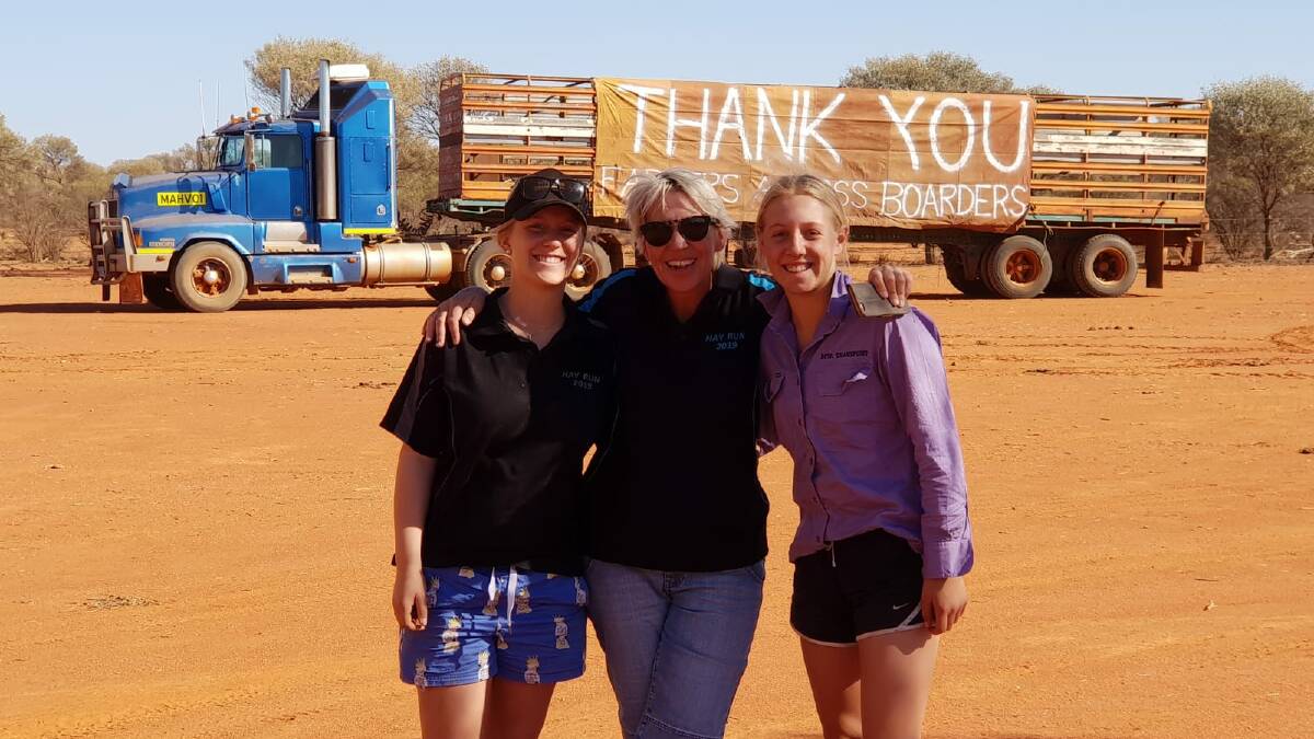 Inaya Stone (left) and her sister Annika Stone with Farmers Across Borders president, Sam Starcevich (middle) on a hay run to the Murchison in March this year.