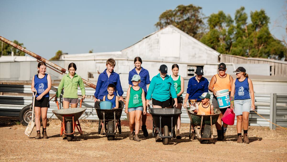 Darkan kids collecting sheep poo at the shearing shed of local sheep farmer Steven Goss to sell at this years Act-Belong-Commit Darkan Sheepfest on Saturday, February 13. Photo by Astrid Volzke.