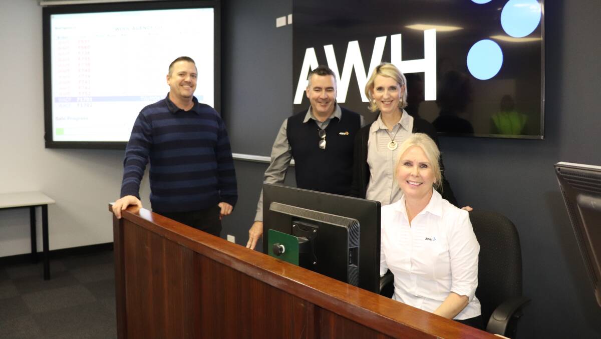Set to go with an upgraded sales data system are Australian Wool Exchange (AWEX) technical controller at the Western Wool Centre Andrew Rickwood, Australian Wool Handlers' Bibra Lake site manager David Messenger and AWEX data imputers Rochelle Coppard and Nicole Vezich before wool auctions resumed last week.