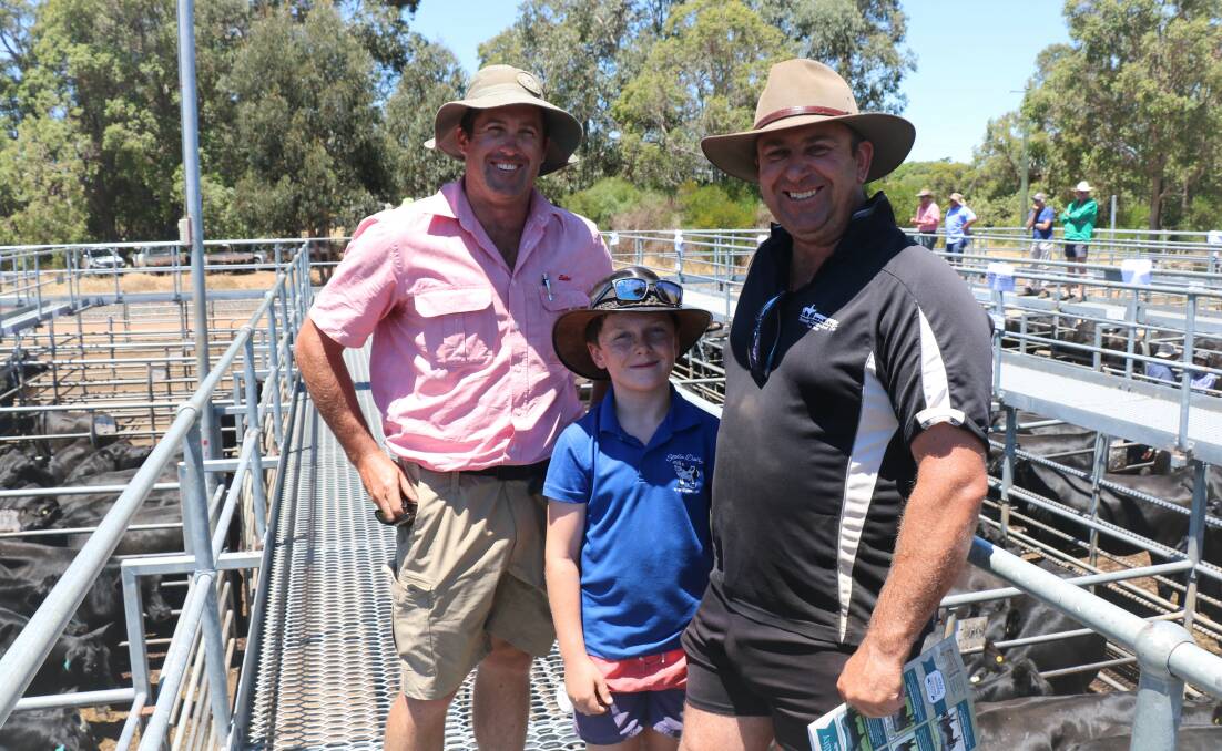 Elders, Brunswick/Harvey representative Craig Martin (left) caught up with Troy and Clayton Minson, Roelands, before the sale. During the sale Clayton sold bucket-reared heifers to $1280.