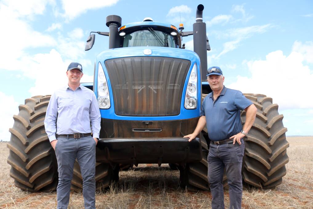 McIntosh & Son group chief executive officer David Capper (left) and Geraldton branch manager Craig Ajduk in front of the New Holland T9 that was part of the drive day.