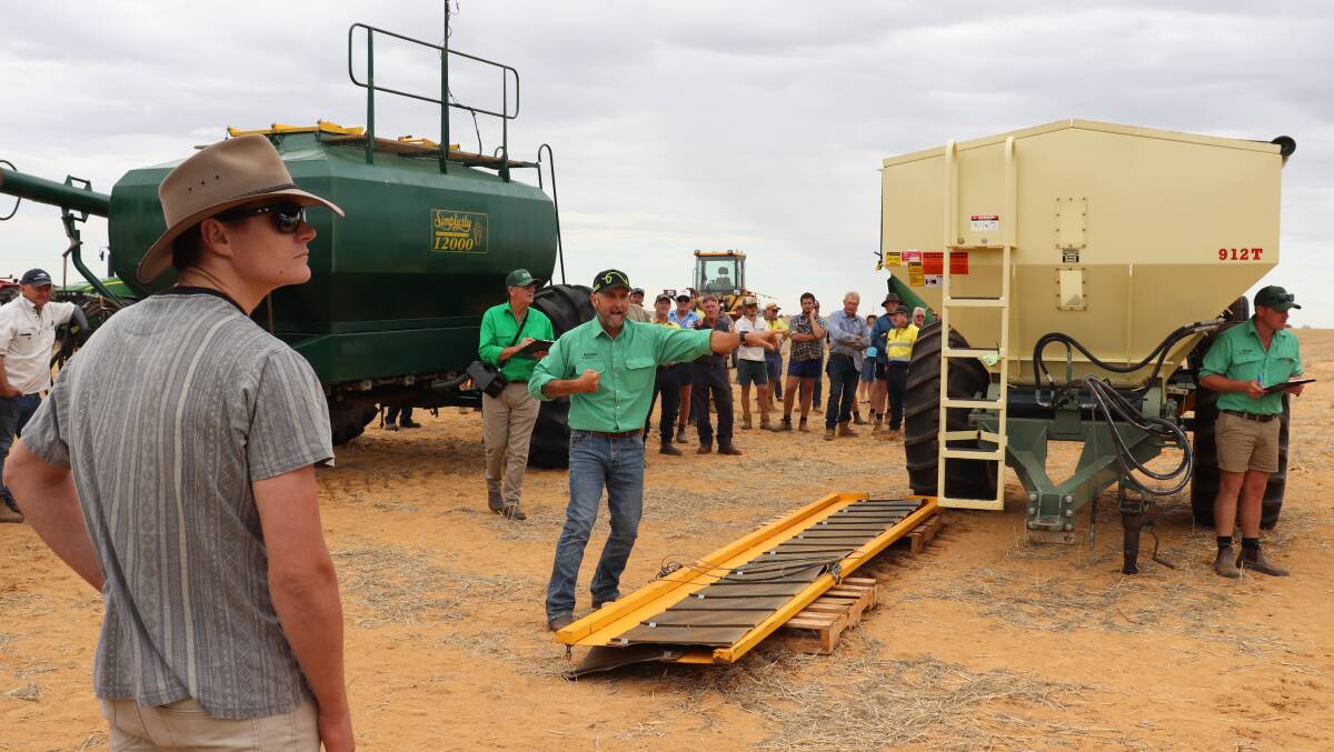 Attendees at the Nutrien Ag Solutions clearing sale at Justin and Sulwyn Mutter's farm last week listen in as the bids reached $30,500 for a 2004 Simplicity 12,000 bin with auger and $48,000 for a 2016 912t Marshall Spreader. The Nutrien team was in full swing keeping up with the bids.