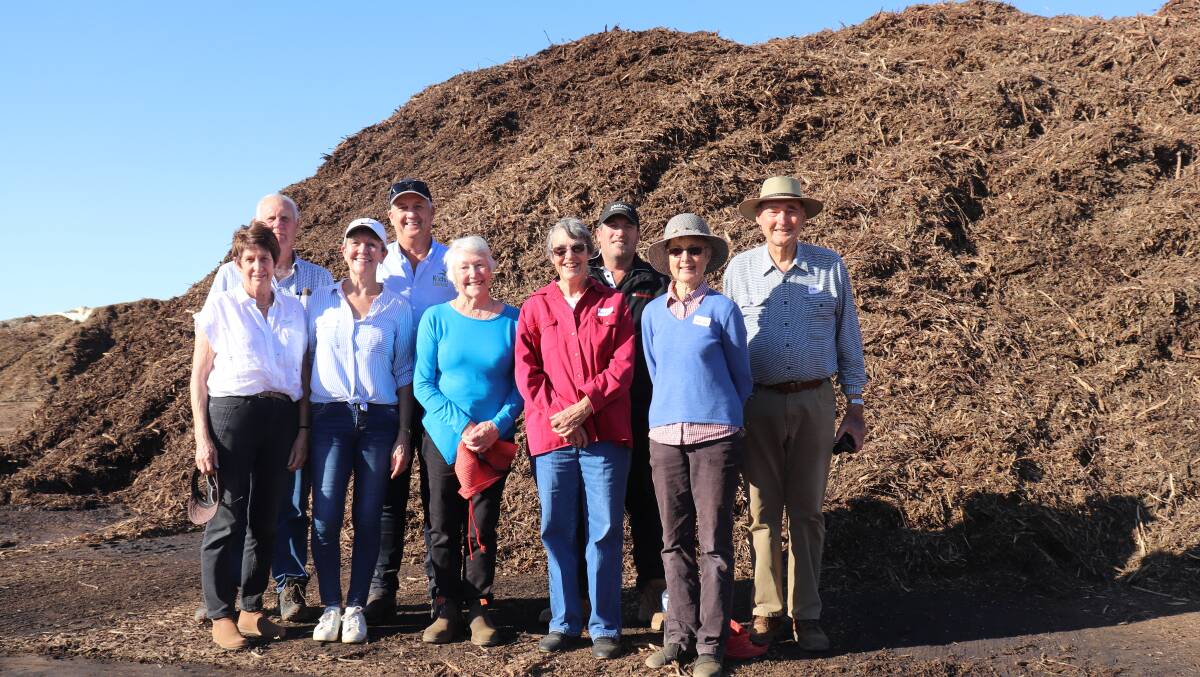 Representatives of five of the original six Kalannie families which founded Kalannie Distillers that later became Kochii Australian Eucalyptus Oil in front of the mountain of biomass that the company plans to use to generate electricity and produce biochar and wood vinegar. Pictured are Helen and Rob Millsteed (left), Robyn and Ian Stanley, Elva Rolinson, Angela and Mark Waters and Helen and Robert Nixon.