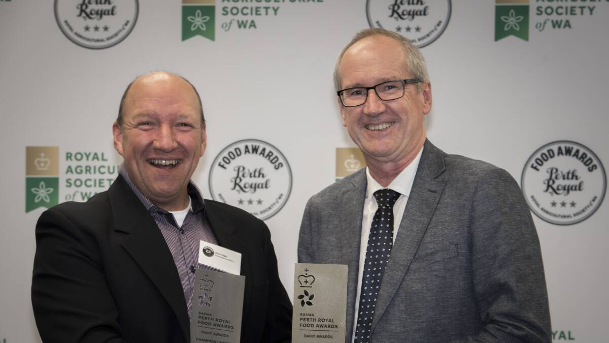 Dellendale Creamery owner and cheese maker Chris Vogel (left), Denmark, is presented with his third Best Small Cheese Maker special award by RASWA president Paul Carter. Photograph: RASWA