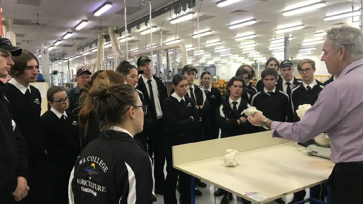 Rob Hallion from the Australian Wool Testing Authority (AWTA) laboratory in Bibra Lake explains to students from the WA College of Agriculture, Cunderdin, how wool from the College's Merino flock is tested. Recently 21 students visited AWTA and the Western Wool Centre to watch the College&#146;s 50-bale wool clip, that they helped shear, sell at auction. Picture: WA College of Agriculture, Cunderdin.