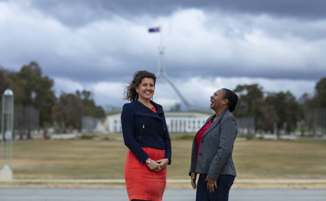 Elizabeth Brennan (left), with mentee Philmah Waken at the Department of Foreign Affairs and Trade Women's Leadership Initiative in Canberra, July, 2018.