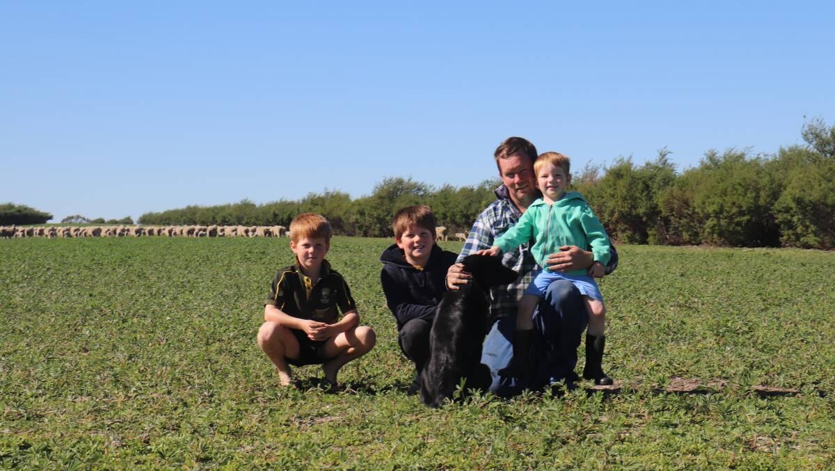 Geoff Cosgrove and sons Simon, Zac and Hamish with their dog Jack.