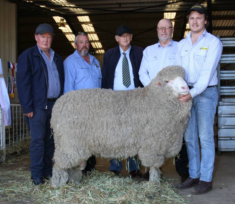 Prices topped at $21,000 for a half semen share in Lewisdale Polly 450 at Lewisdale's 57th annual on-property ram sale at Wickepin last week. With the top-priced semen sire were Lewisdale stud principal Ray Lewis (left), buyer Andrew Kitto, Dyson Jones, Lewisdale stud representative of 53 years John Sherlock, AWN auctioneer Don Morgan and Sam Howie, Dyson Jones.