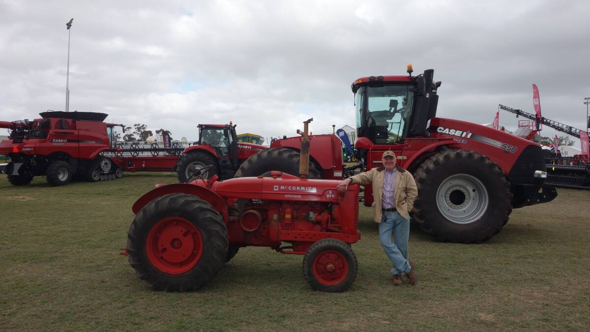 Farm Machinery & Industry Association executive officer John Henchy poses next to this McCormick A65 tractor at a recent field day with the 'big girl' in the back ground, a Case IH Steiger 550 tractor. RedMac Three Springs dealer principal Brett Young, who is sponsoring a tractor time trial at the annual Cervantes 'Roar by the Shore' weekend, has entered the McCormick in the event. 