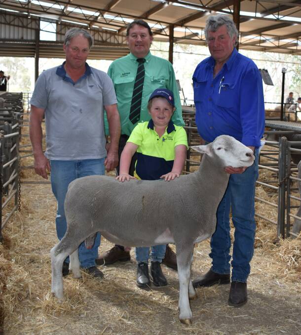 Buyer Bevan Brown (left), JOH Grazing Kojonup, with business partner Troy Hornby's son Henry, 8, Nutrien Livestock Breedings Roy Addis and Glencraobh and Amberley stud principal Garry Mitchell, with one of the studs $1600 equal top-priced Poll Dorset rams.