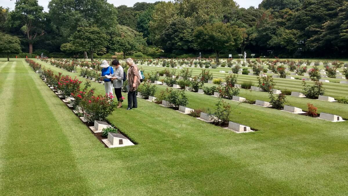 Barbara Mottershaw (right) at the Yokohama Commonwealth War Cemetery, 30 kilometres south of Tokyo. Established by the Australian War Graves group in 1945, it is funded and maintained by the Australian Government with sections for Australian, Canadian, New Zealand, British and Indian service personnel who died in PoW camps.