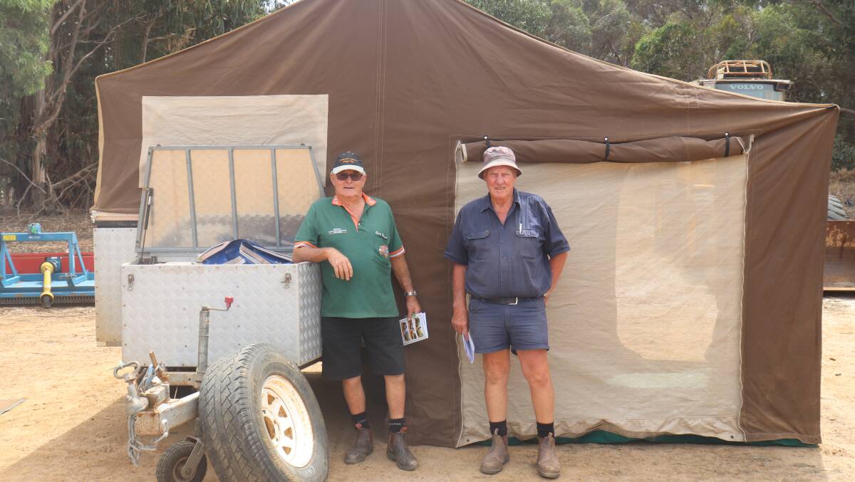 Ewen Stewart (left), Esperance and Graham Cooper, Esperance, assessing the 4.1m x 1.7m camper trailer, which sold for $1900 to an Esperance buyer.