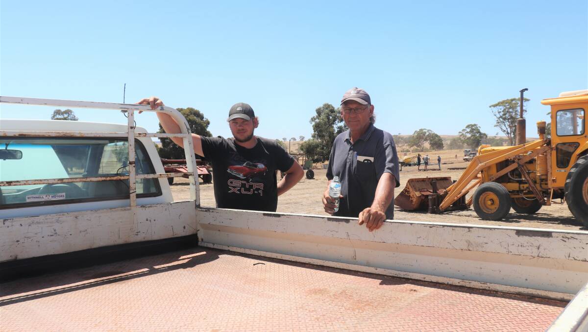 Ashley Evans (left), Katanning, and his father Eric checking out the 2002 Rodeo utility with 80,000 kilometres on its 2.8 litre Isuzu diesel engine. It later sold for $7000.
