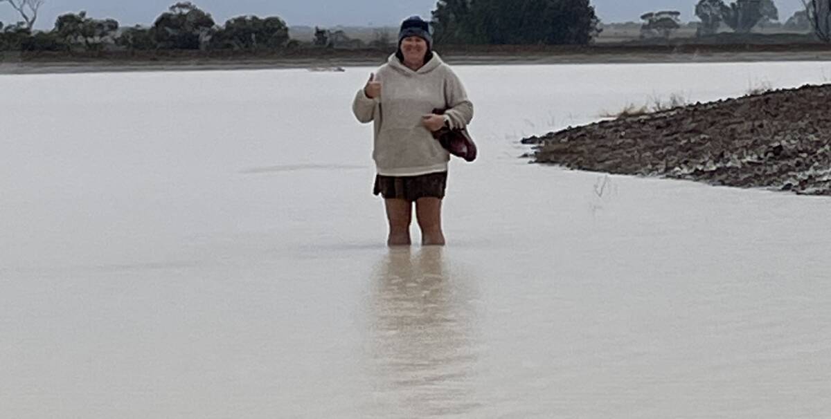 Tash Piggott in flood waters that came up and over her gumboots.