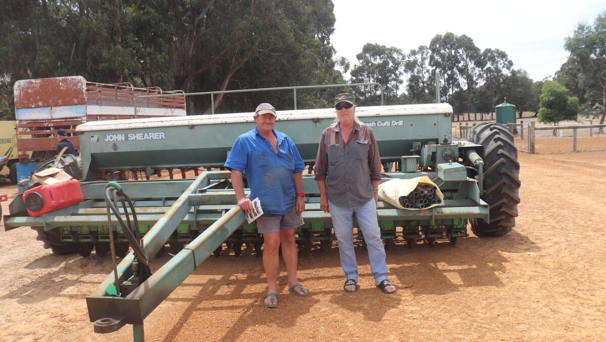 Geoff Thomas (left), Merivale and Andrew Kolatowicz, Esperance, inspecting the John Shearer culti-trash seeder, which later sold for $19,500.