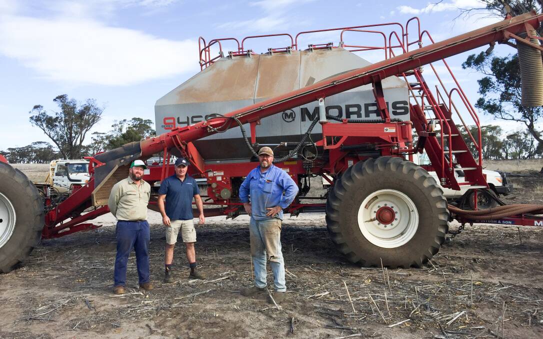 Amelup growers Darren Moir (centre) and Paul Richardson (right) with Michael Fethers, McIntosh & Son Albany, and the family's Morris 9450 air cart that is fitted with Input Control Technology (ICT).