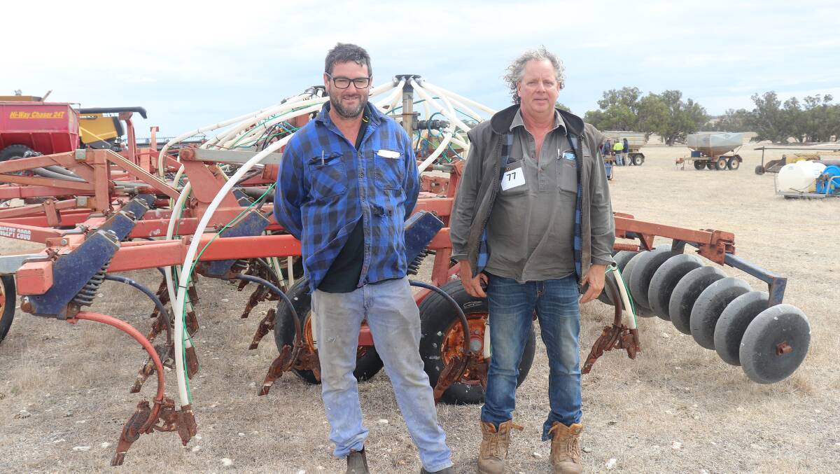 Craig Ivey (left) and Hayden Silvester, both from Kojonup, with the Morris seeding rig.