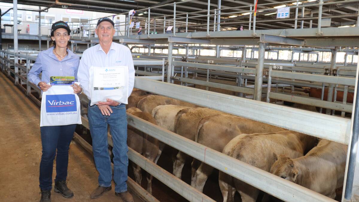 With the second place Charolais sired steers from GJ Elliott, North Dandalup, is Virbac central WA area sales manager and sponsor Kylie Meloury and AWN Livestock WA cattle manager Phil Petricevich. The pen of nine steers made $980 at 256c/kg in the sale.