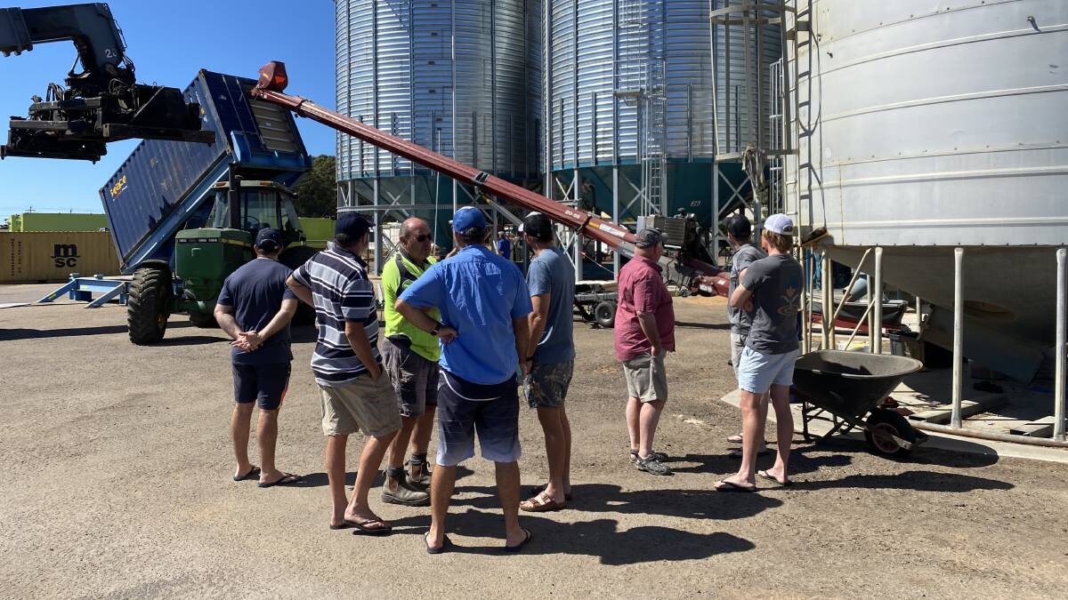 Former CBH Group director Neil Wandel (centre in high-vis shirt) explains his Esperance Quality Grains operation to the Nutrien Ag Solutions tour group.