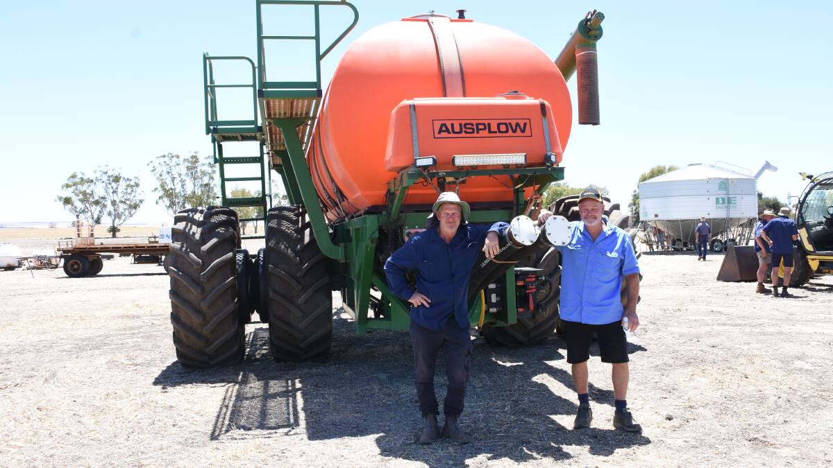 David Millsteed (left), Wongan Hills and Peter Latham, West Kondut, were looking over the 2015 Ausplow M22000 Multistream airseeder before the sale started. In the sale the airseeder sold for $100,000.