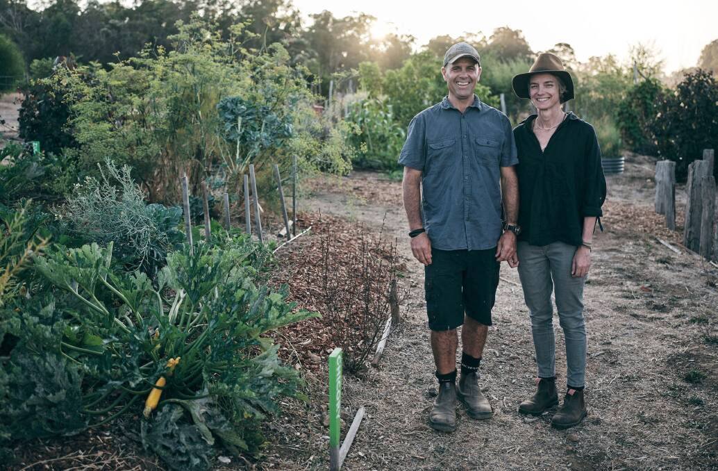 Tim Hill and Cree Monaghan in their One Table Farm vegetable garden. Photo by Russell Ord.