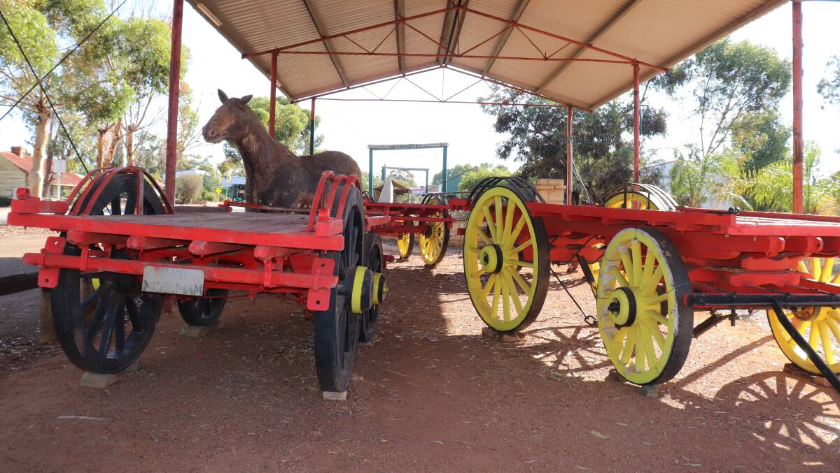 A roadside historic display in Brookton features some of Mr Gill's wagons and a fibreglass Clydesdale horse.