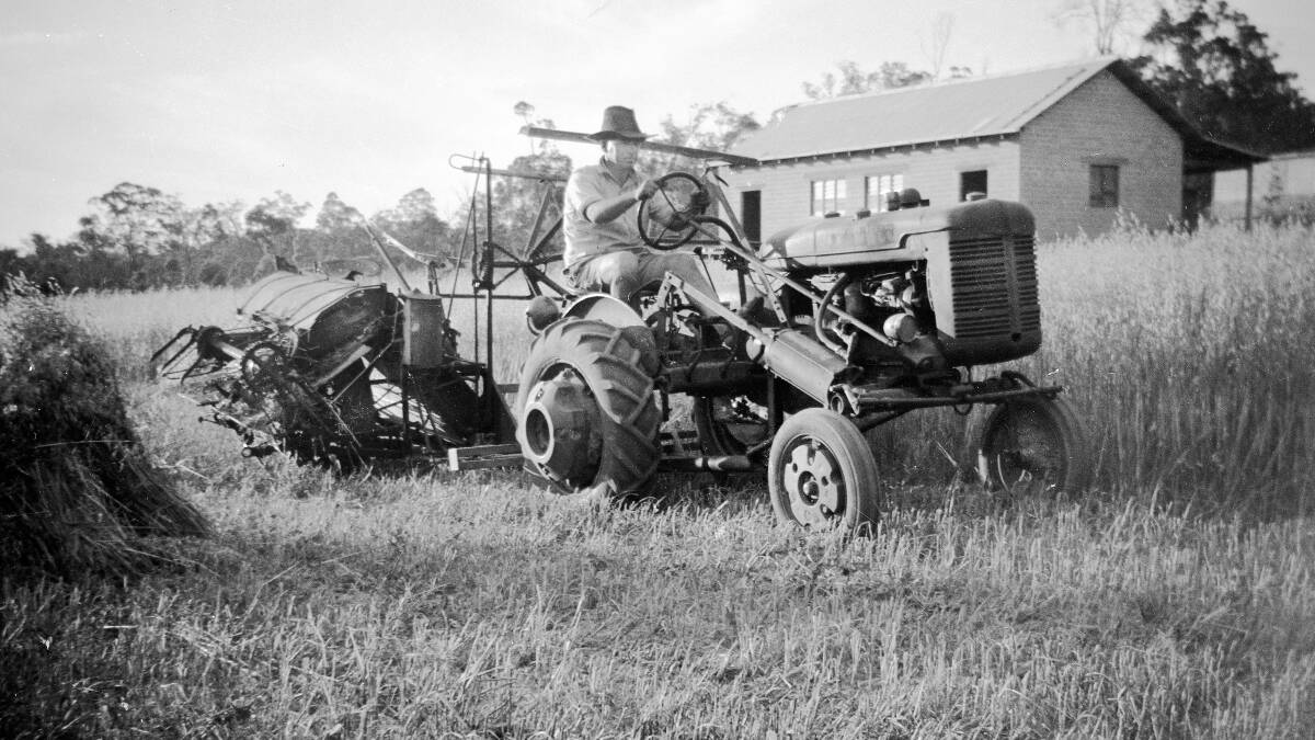 Ray Owen cutting hay at his fruit orchard in the Perth Hills.