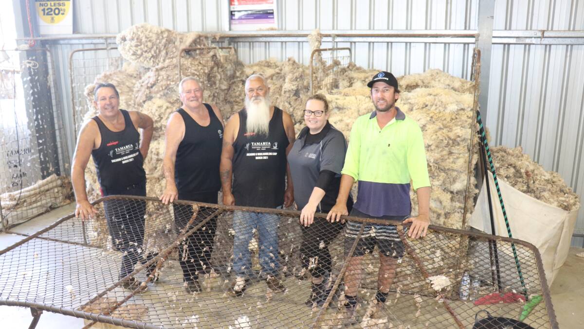 Heiniger WA sales manager and shearer trainer Todd Wegner (left), Australia Wool Innovation (AWI) shearer trainer Kevin Gellatly, Aboriginal mentor Ian Rivers, AWI wool handling trainer Amanda Davis and shearing school host Kim Creagh, Tamarua Pastoral Company, in front of the oddments trimmed from fleece by the trainee shearers and wool handlers.
