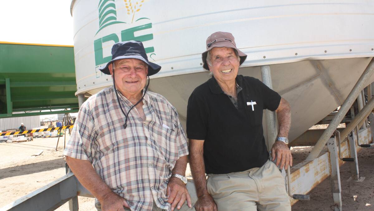 Waiting for the crowd to arrive for the sale of sundry lots were Stan Ennis (left), Bullsbrook and Eric Taylor, Bullsbrook. They were pictured next to a DE Engineers 2010 grain cleaner which sold for $35,000.