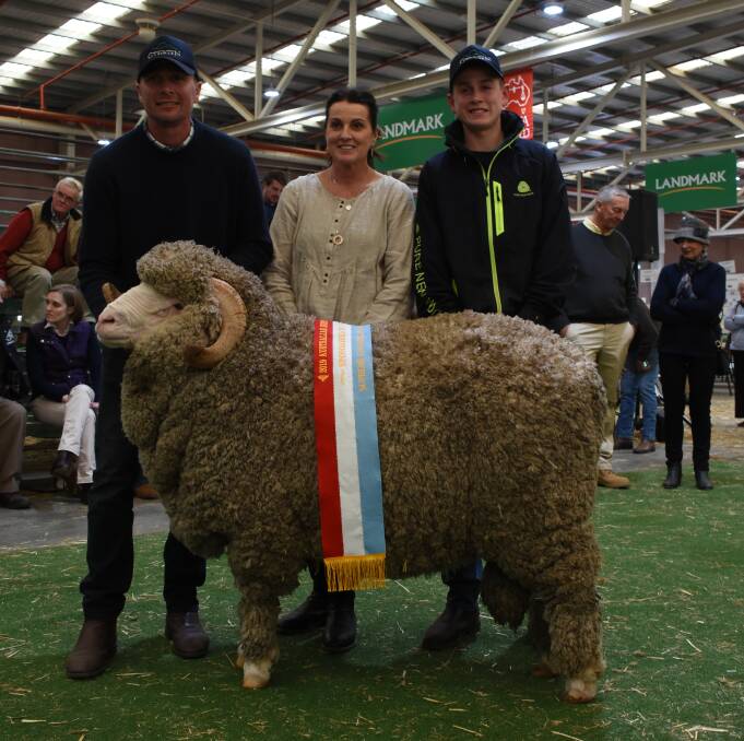 The Miller family, Glenpaen stud, Brimpaen, Victoria, took home the supreme ribbon when their grand champion ram was awarded the title. With the ram are Rod (left), Sue and Harry Miller.