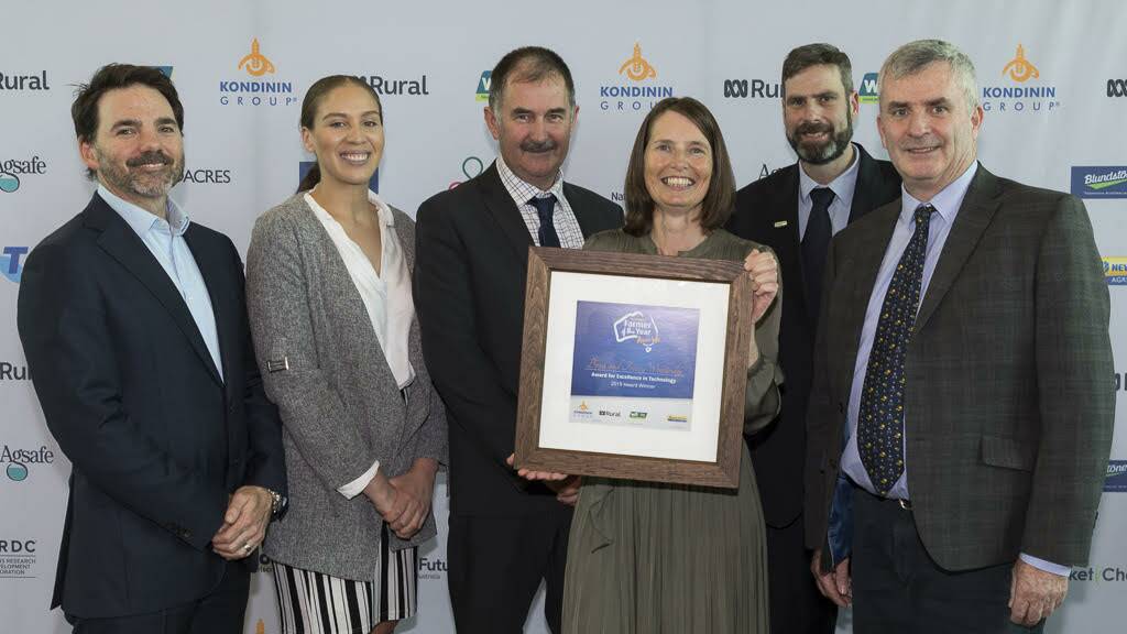 Award for Excellence in Technology winners Brad and Tracey Wooldridge (centre), Arthur River, with representatives of award sponsor New Holland.