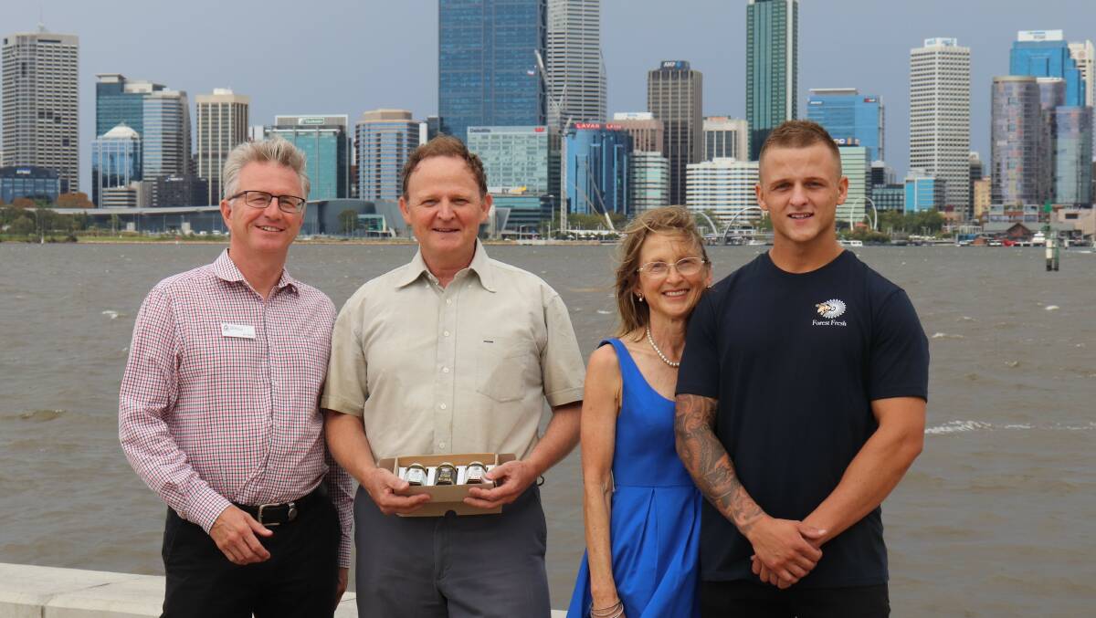 DPIRD project manager Jon Berry with one of the recipients of the Expert for a Day grant Mike and Susie Fewster and their son Matt, who help manage their family's business, Fewster's Farm Honey.