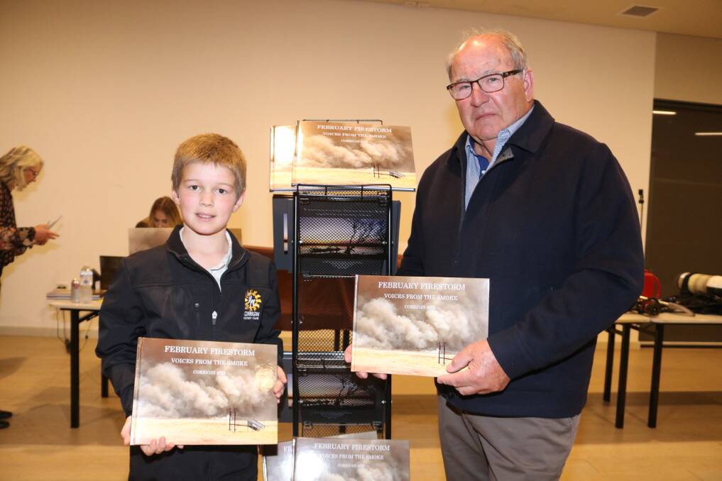 Kade Crombie (left), 11, Babakin Primary School, officially unveils the book with Corrigin Shire president Des Hickey at the Corrigin Recreation and Events Centre last Friday night.