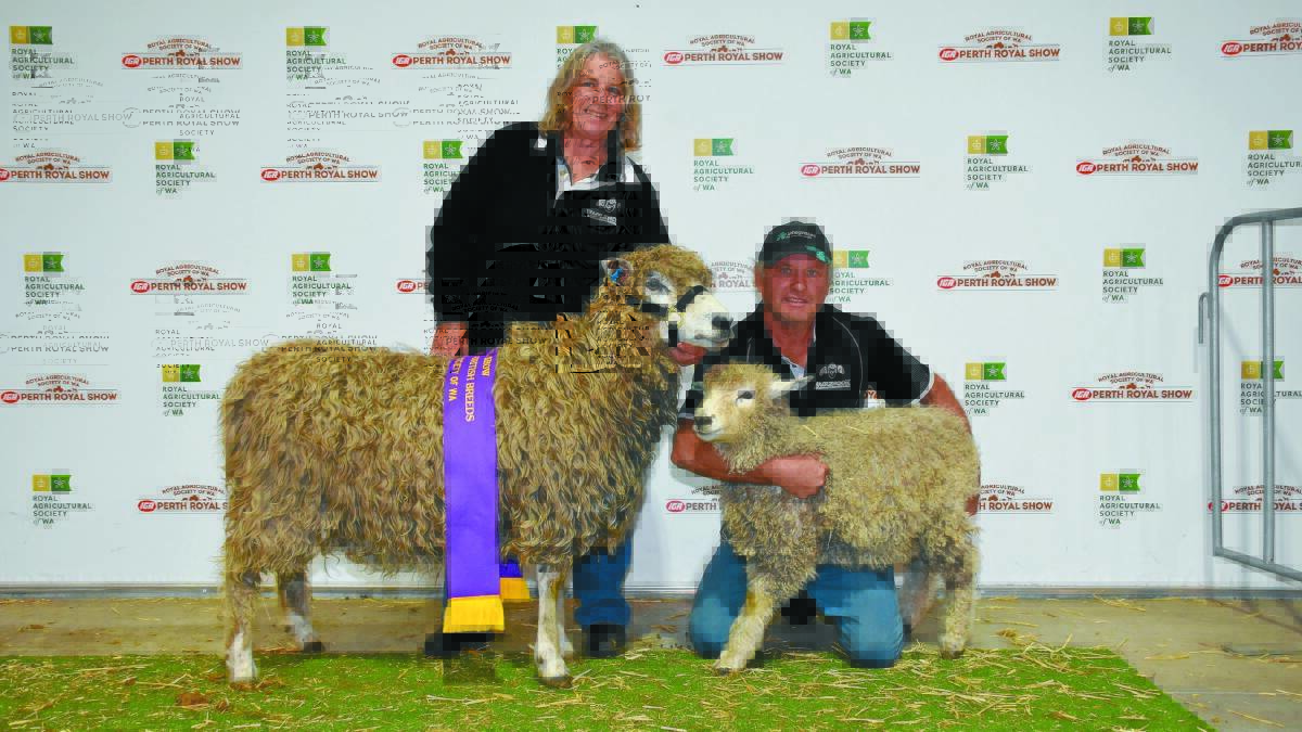 With the grand champion British breed ewe, a Lincoln from the Eaglenook stud, Keysbrook, were stud principals Ross and Ruth Miller.
