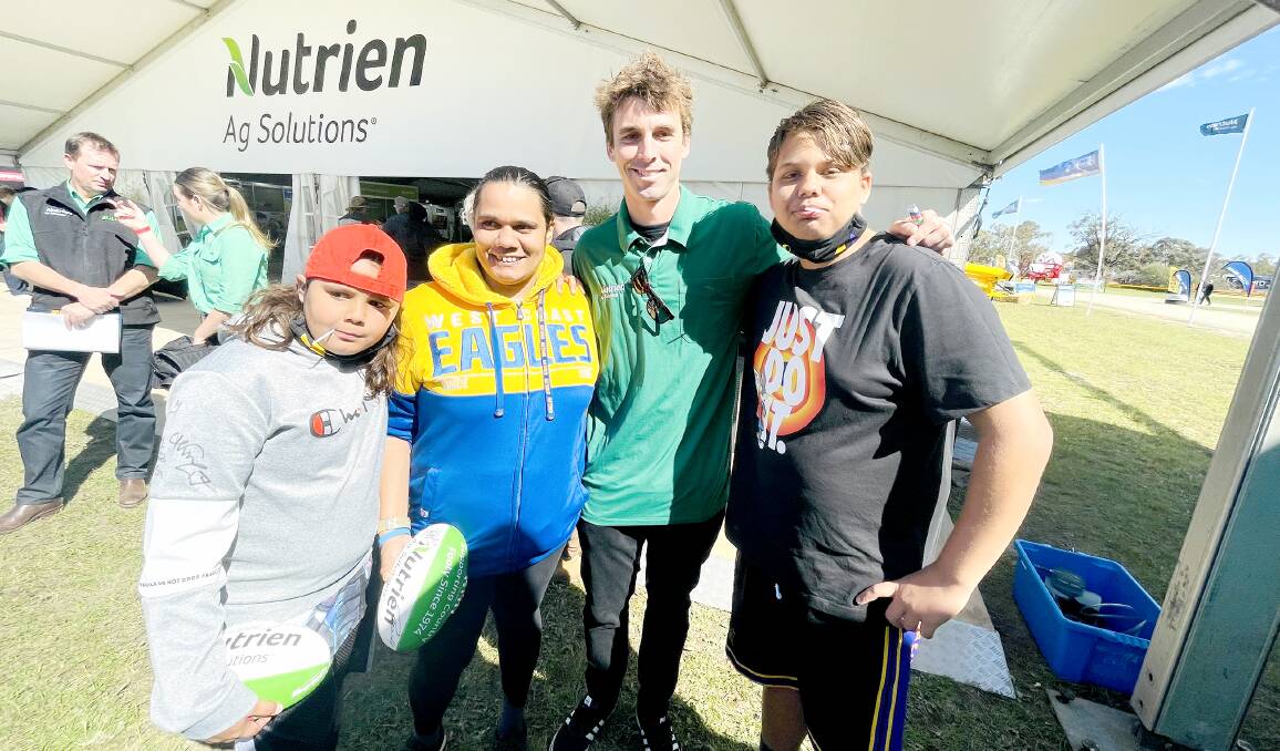  Lucas McKeagg (left), 10, along with his mum Gwynette Phillips and big brother Jackson McKeagg (right), 14, caught up with West Coast Eagles footballer Jamie Cripps at the Nutrien Ag Solutions display on the second day.