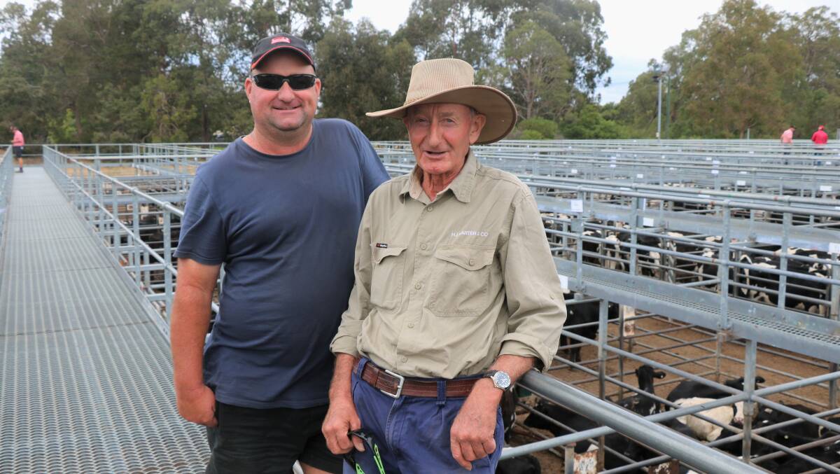 Mathew (left) and Graham Carter, Marybrook, attended the Elders store sale to buy young dairy steers, taking home poddies for $1010.