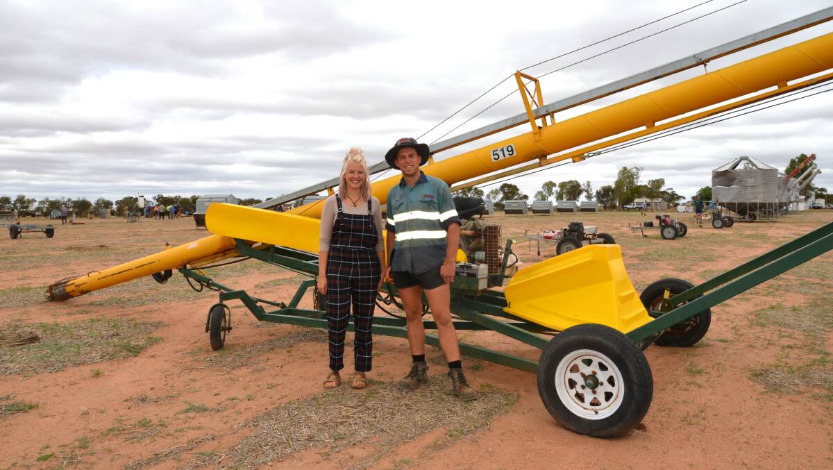 Tyla and Wade Archer, Merredin, with a Grain Commander 519 self-propelled grain auger that sold for $15,000.