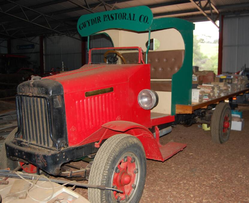 A famous 1928 International tray truck with wooden seat and cab.