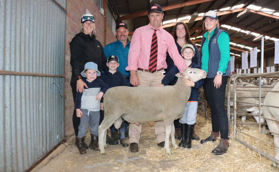 The $2100 top-priced Rhos Gwyn ram was bought by the Pugh family, Narrikup. With the ram were buyer Clare King (left), Narrikup, with her sons Theodore and George, Elders Mt Barker representative Dean Wallinger flanked by Rhos Gwyn stud principals Rob and Stacey Bush, Henry King and Hayley Smith, Narrikup.