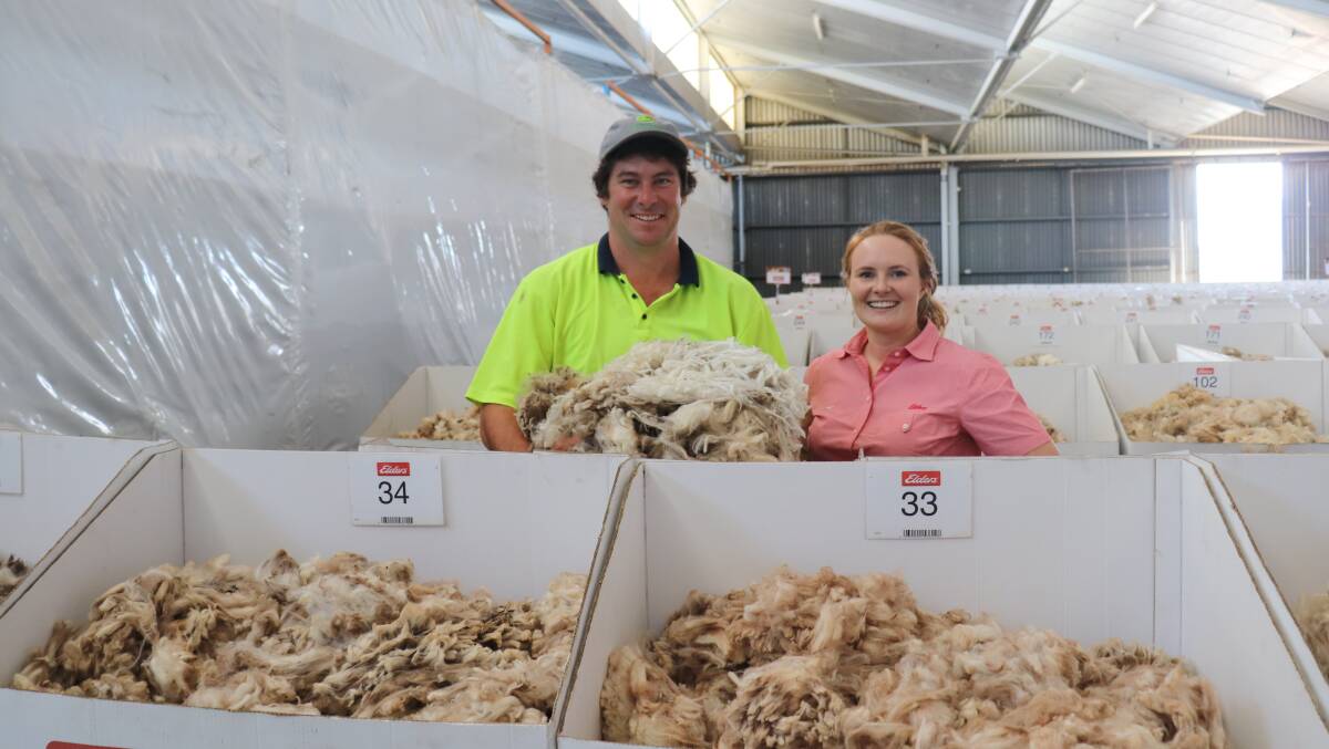  Glenn Smith, Wongamine farm between Northam and Meckering, inspecting his show floor wool samples with Elders Northam, Moora, Carnamah and Mingenew district wool manager Breanna Hayes when visitors were welcome on show floors.