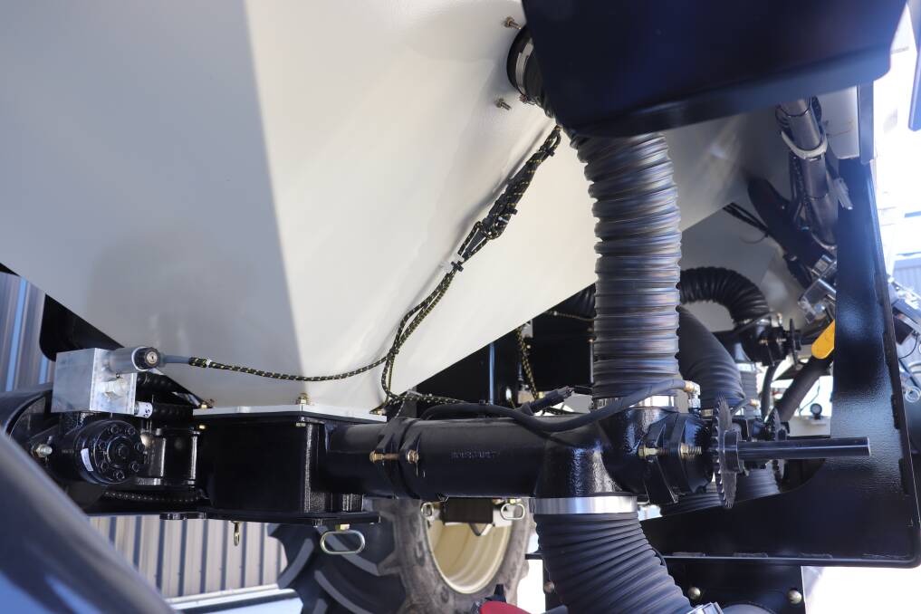 Underneath a Bourgault air seeder showing the new cable harness system designed by AFGRI technical adviser Mark Adamson, which enables the John Deere GDRC 200 Rate Controller to work with the Bourgault system. It took a year for Mr Adamson to design and test the system which now comes as an option for air seeder purchases.